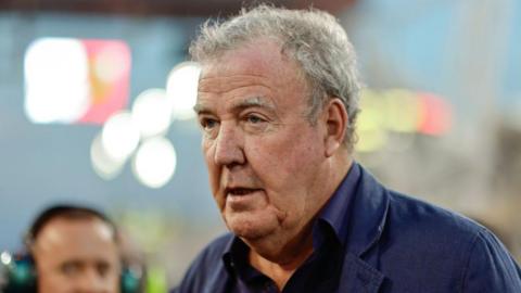 Jeremy Clarkson looking beyond the camera. He is wearing a black shirt and jacket.