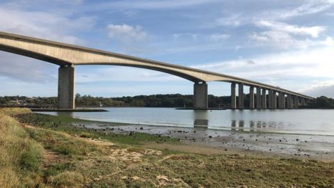The Orwell Bridge over the River Orwell on a sunny day.