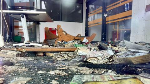 The destroyed interior of the Spellow Hub community library