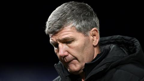 Exeter Chiefs director of rugby Rob Baxter looks downcast