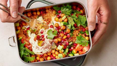 Harissa couscous with crispy chickpeas, hummus and herbs