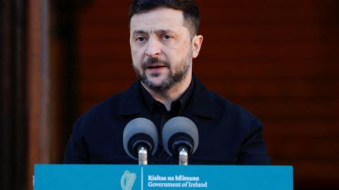 Zelensky speaks into a microphone while speaking at a press conference in Dublin on Tuesday