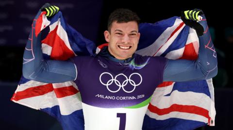 GB's Matt Weston celebrates winning gold in the skeleton