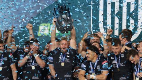 Glasgow Warriors hoist the URC trophy aloft