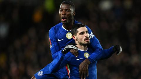 Moises Caicedo and Pedro Neto celebrating for Chelsea against Hull