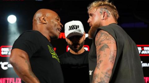 Jake Paul and Mike Tyson face off at a news conference