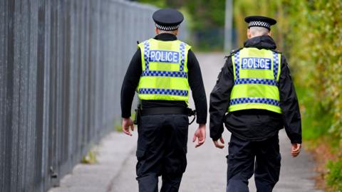 Police officers patrol the streets and urban areas of the town centre, on June 7, 2025 in Poole, United Kingdom. 