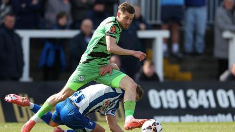 Harvey Bunker beats a Hartlepool defender for Forest Green with the ball at his feet