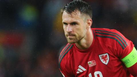 Aaron Ramsey leans forward