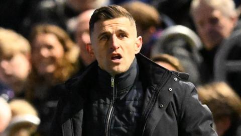 Portsmouth boss John Mousinho on the touchline during their game against Plymouth