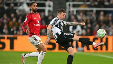 Kieran Trippier gets to the ball before Matheus Cunha during Newcastle United's game against Manchester United at St James' Park on 4 March, 2026