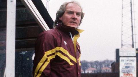 Terry Yorath looks on at pitchside