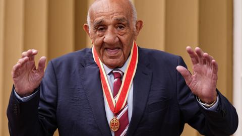 Sir Billy Boston received rugby league's first knighthood at Buckingham Palace