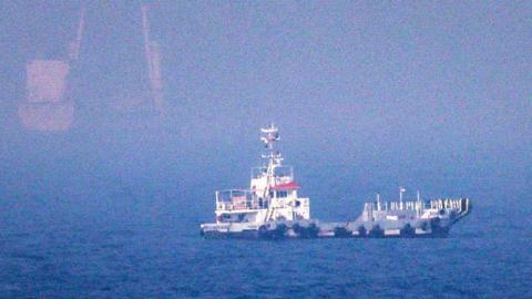 This picture shows ships sailing near the Strait of Hormuz off the eastern coast of the United Arab Emirates at Khor Fakkan on July 13, 2026