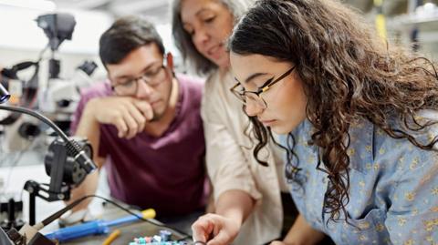 Students and a teacher in a science lab