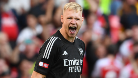 Goalkeeper Aaron Ramsdale reacts after making a save for Arsenal