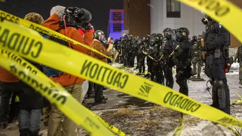 MINNEAPOLIS, UNITED STATES - JANUARY 26: Protesters clash with law enforcement while holding a 'noise demonstration' outside of a hotel believed to be housing federal immigration agents near Minneapolis, United States, on January 26, 2025. 