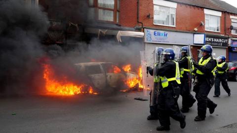 A car burns on Parliament Road after it was set alight by far-right activists holding a demonstration in Middlesbrough on August 04, 2024 in Middlesbrough, England