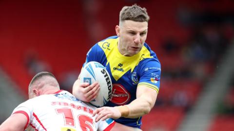 George Williams is tackled for Warrington