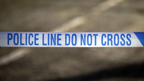 A general shot of blue and white police tape at a police incident