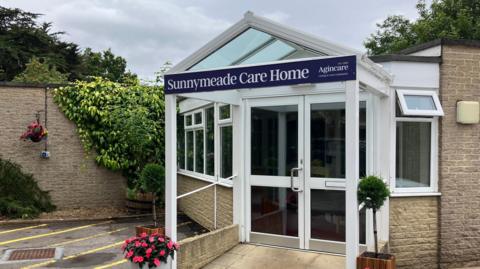 Exterior of Sunnymeade Care ˿ with the Agincare branding on it