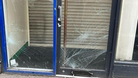 Two glass doors smashed.