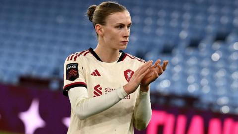 Liverpool's Jenna Clark applauds the fans after losing at Aston Villa