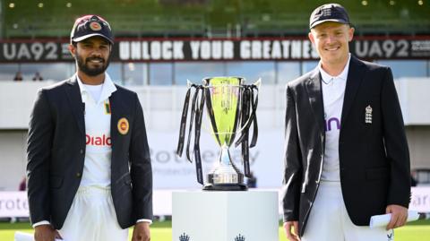 Sri Lanka captain Dhananjaya de Silva and England stand-in skipper Ollie Pope with the Test series trophy