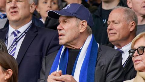 Portsmouth owner Michael Eisner watching on at Fratton Park in April wearing a Pompey cap and scarf
