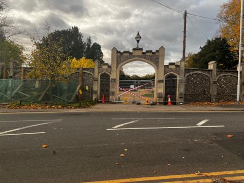 A GV of the damaged gates in Caversham.