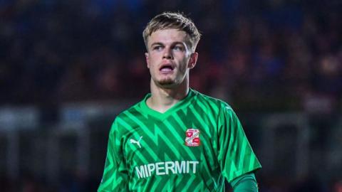 Murphy Cooper playing for Swindon