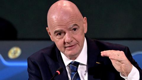 Gianni Infantino gesticulates at the Fifa congress in Paraguay 