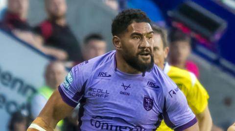 Kelepi Tanginoa, playing for Hull KR away to Wigan in August 2025, with the referee in a yellow kit just behind him 