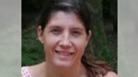 A close up photograph of Donna Ball. She is smiling and has brown hair tied back in a ponytail. The sides of the image are blurred.