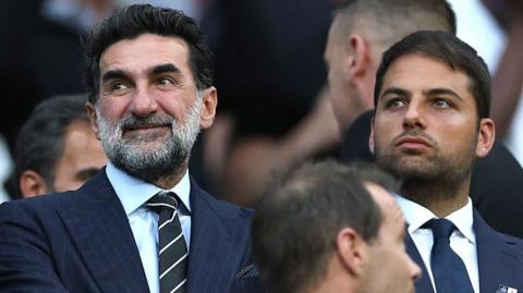 Newcastle United chairman Yasir Al-Rumayyan and owner Jamie Reuben watch on during the game against Liverpool at St James' Park on 25 August, 2025