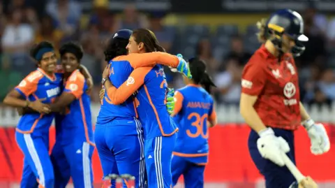 India celebrate a wicket