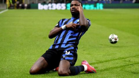 Marcus Thuram celebrates scoring for Inter in the Champions League