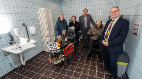 Ripon Disability Forum trustee, Daniel Abel, Changing Places supporter Mike Chambers MBE, Disability Forum trustee, Lynette Barnes, councillor Andrew Williams, Disability Forum trustee, Stewart Aitkin, and councillor Gareth Dadd in the new facility