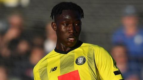 Emmanuel Ilesanmi in action for Harrogate Town