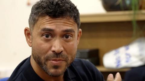 Rav Wilding looking directly at the camera.