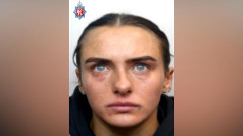 Police provided headshot of Megan Murphy who has her hair tied back and is wearing dark clothing.