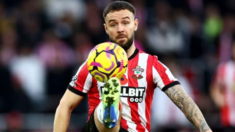 Adam Armstrong controls the ball while in action for Southampton earlier in the season