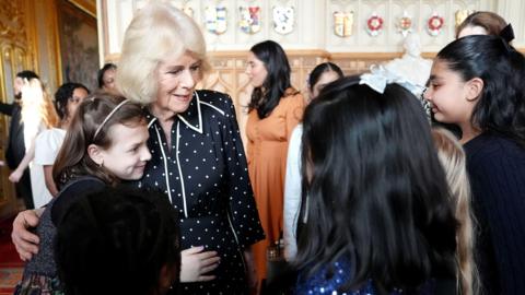 Queen Camilla during a reception with finalists, judges and celebrity readers, to celebrate the final of BBC's creative writing competition 500 Words, at Windsor Castle, Berkshire.