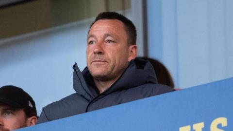 John Terry watches Colchester v Accrington