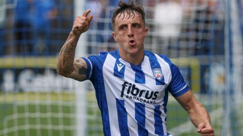 Joel Cooper celebrates scoring