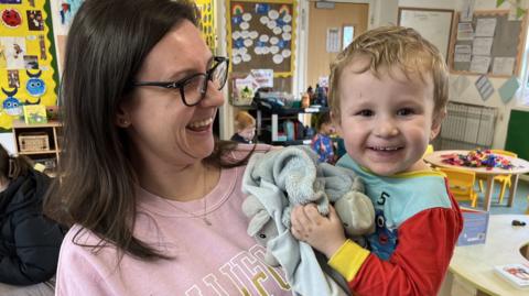 Mum, Cayla Harle, holding her son, Arthur, who goes to Rainbow Early Years