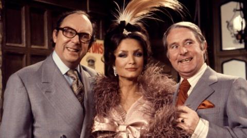 Comedy duo Eric Morecambe and Ernie Wise with actress Kate O'Mara.