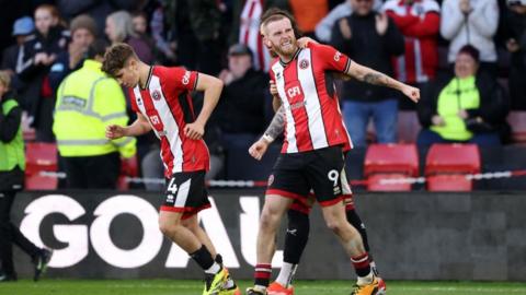 Oliver McBurnie of Sheffield United celebrates scoring his team's second goal during the Premier League match between Sheffield United and Chelsea FC