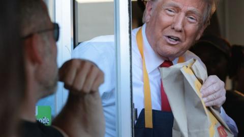 Trump serves fries at McDonald's