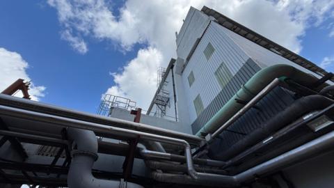 Ground level view up part of the exterior of the district heating turbine hall